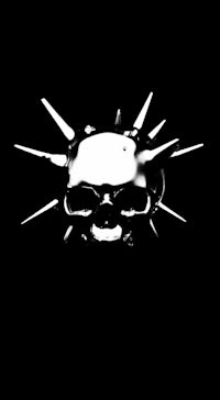 a skull with spikes on it on a black background